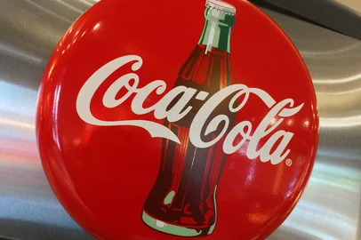 (FILES) A Coca-Cola logo is seen in a restaurant in Washington, DC on May 1, 2016. Coca-Cola's European bottler in Belgium announced on January 27, 2025 a massive recall of products in Europe due to excessive chlorate content. (Photo by Karen BLEIER / AFP)<!-- NICAID(15962670) -->