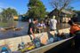 VÍDEO: isolados, moradores da Ilha Mauá recebem doações por barco<!-- NICAID(15607090) -->