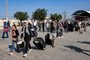 People enter the Rafah border crossing in the southern Gaza Strip before crossing into Egypt on November 1, 2023. Scores of foreign passport holders trapped in Gaza started leaving the war-torn Palestinian territory on November 1 when the Rafah crossing to Egypt was opened up for the first time since the October 7 Hamas attacks on Israel, according to AFP correspondents. (Photo by Mohammed ABED / AFP)Editoria: WARLocal: RafahIndexador: MOHAMMED ABEDSecao: conflict (general)Fonte: AFPFotógrafo: STF<!-- NICAID(15585367) -->