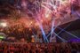 Spectators at the World Stage watch fireworks go off on the first day of 'Rock in Rio', in Rio de Janeiro, Brazil, on September 15, 2017. Running for seven days in all -- Friday through Sunday and then September 21 to 24 -- Rock in Rio is being welcomed by the city as a chance to put the huge facilities built for the 2016 Olympic Games back in use. They have hosted only sporadic events since the Olympics ended in August of that year. While Brazil is only starting to emerge from a painful recession, the 700,000 tickets to the event sold out months ago and city hotels are hoping to be nearly full, reversing a prolonged post-Olympic slump. / AFP PHOTO / Apu Gomes