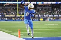 INGLEWOOD, CALIFORNIA - DECEMBER 08: Omarion Hampton #8 of the Los Angeles Chargers scores a first quarter touchdown against the Philadelphia Eagles at SoFi Stadium on December 08, 2025 in Inglewood, California.   Katelyn Mulcahy/Getty Images/AFP (Photo by Katelyn Mulcahy / GETTY IMAGES NORTH AMERICA / Getty Images via AFP)<!-- NICAID(16183278) -->