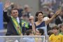 Brazilian President Jair Bolsonaro (L) and First Lady Michelle Bolsonaro wave during a military parade to mark Brazil's 200th anniversary of independence in Brasilia, on September 7, 2022. (Photo by EVARISTO SA / AFP)Editoria: SCILocal: BrasíliaIndexador: EVARISTO SASecao: human scienceFonte: AFPFotógrafo: STF<!-- NICAID(15199033) -->