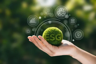 Hand of human holding green earth ESG icon for Environment Social and Governance, World sustainable environment concept.<!-- NICAID(15908986) -->