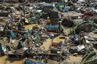 This aerial photo shows damaged houses in the aftermath of Typhoon Kalmaegi in Talisay, in  Cebu province on November 5, 2025. The death toll from Typhoon Kalmaegi in the Philippines climbed to 66 on November 5, as residents of hardest-hit Cebu province began picking through homes and businesses devastated by the worst flooding in recent memory. (Photo by Jam STA ROSA / AFP)<!-- NICAID(16160859) -->