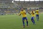Brazil's forward Neymar (L) celebrates with teammate Dani Alves after scoring against Mexico during their FIFA Confederations Cup Brazil 2013 Group A football match, at the Castelao Stadium in Fortaleza, on June 19, 2013.  AFP PHOTO / YURI CORTEZ<!-- NICAID(9494070) -->