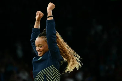 Second-placed Brazil's Rebeca Andrade celebrates during the podium ceremony after the artistic gymnastics women's all around final during the Paris 2024 Olympic Games at the Bercy Arena in Paris, on August 1, 2024. (Photo by Loic VENANCE / AFP)<!-- NICAID(15831966) -->