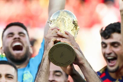 Spain's midfielder #16 Rodri lifts the trophy with his teammates after winning the 2026 World Cup football tournament final match between Spain and Argentina at the New York/New Jersey Stadium in East Rutherford on July 19, 2026.  (Photo by FRANCK FIFE / AFP)<!-- NICAID(16329938) -->
