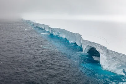 (FILES) This handout image released by EYOS Expeditions on January 19, 2024, shows an aerial view of the A23a iceberg in the waters of The Southern Ocean off Antarctica on January 14. The world's biggest iceberg appears to have run aground, potentially sparing the crucial wildlife breeding ground of South Georgia from being hit by the behemoth, the British Antarctic Survey said on March 4, 2025. (Photo by IAN STRACHAN / EYOS Expeditions / AFP) / RESTRICTED TO EDITORIAL USE - MANDATORY CREDIT "AFP PHOTO/EYOS EXPEDITIONS/IAN STRACHAN " - NO MARKETING - NO ADVERTISING CAMPAIGNS - DISTRIBUTED AS A SERVICE TO CLIENTS<!-- NICAID(15989669) -->