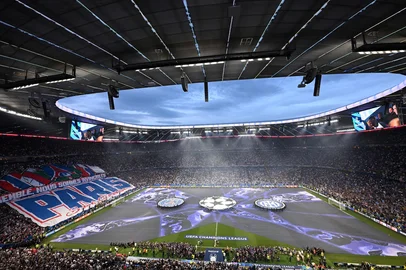 Fans follow the ceremony prior to the UEFA Champions League final football match between Paris Saint-Germain (PSG) and Inter Milan in Munich, southern  on May 31, 2025. (Photo by Kirill KUDRYAVTSEV / AFP)<!-- NICAID(16050618) -->