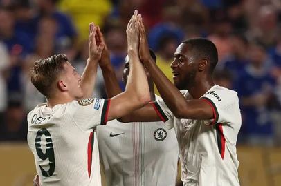 Chelsea's forward #09 Liam Delap celebrates after scoring his team's second goal with teammate English defender #04 Tosin Adarabioyo during the FIFA Club World Cup 2025 Group D football match between Tunis' Esperance Sportive de Tunis and England's Chelsea at the Lincoln Financial Field stadium in Philadelphia on June 24, 2025. (Photo by FRANCK FIFE / AFP)<!-- NICAID(16066793) -->