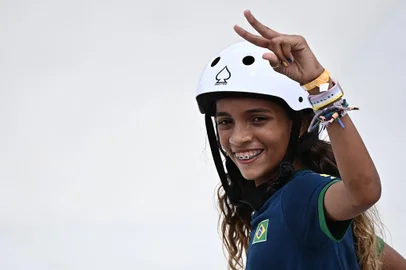Brazil's Rayssa Leal reacts after performing a trick during the women's street preliminary round during the Tokyo 2020 Olympic Games at Ariake Sports Park Skateboarding in Tokyo on July 26, 2021. (Photo by Lionel BONAVENTURE / AFP)<!-- NICAID(14849059) -->