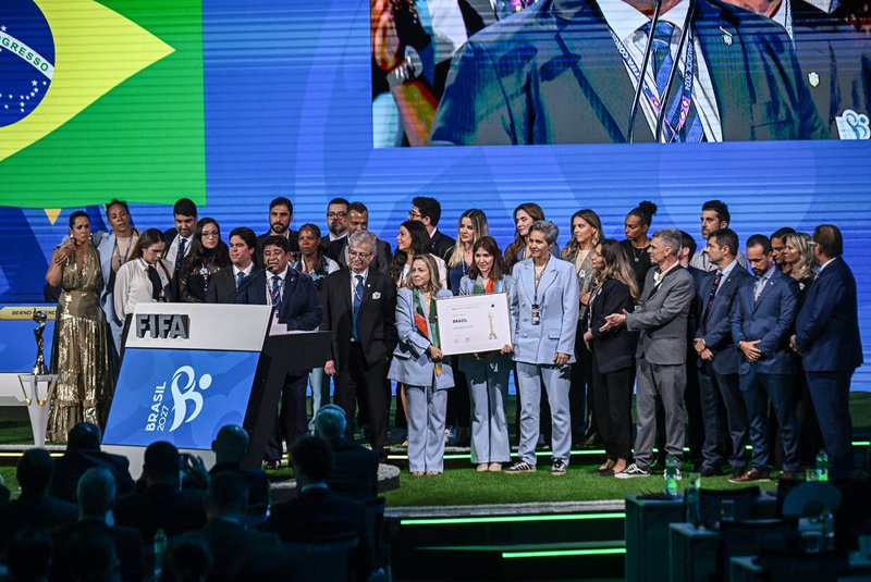 Brazilian Football Association President Ednaldo Rodrigues is surrounded by his delegation as he makes a speech after Brazil wins its bid to host the 2027 Women's World Cup during the 74th FIFA Congress in Bangkok on May 17, 2024. The 74th FIFA Congress is taking place in Bangkok with member associations voting on a range of issues including confirmation of the host nation or nations for the 2027 women's football World Cup. (Photo by Lillian SUWANRUMPHA / AFP)<!-- NICAID(15766497) -->