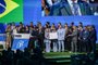 Brazilian Football Association President Ednaldo Rodrigues is surrounded by his delegation as he makes a speech after Brazil wins its bid to host the 2027 Women's World Cup during the 74th FIFA Congress in Bangkok on May 17, 2024. The 74th FIFA Congress is taking place in Bangkok with member associations voting on a range of issues including confirmation of the host nation or nations for the 2027 women's football World Cup. (Photo by Lillian SUWANRUMPHA / AFP)<!-- NICAID(15766497) -->