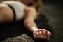 Close up of exhausted athlete resting on the floor after sports training. Atleta exausta no chão - Foto: Drazen/stock.adobe.comIndexador: Drazen ZigicFonte: 253779185<!-- NICAID(15600124) -->