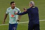 Brazil's coach Tite speaks with Brazil's defender #06 Alex Sandro during a training session at the Al Arabi SC Stadium in Doha on December 6, 2022, in the build-up to the Qatar 2022 World Cup quarter final football match between Brazil and Croatia. (Photo by NELSON ALMEIDA / AFP)<!-- NICAID(15287510) -->