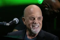 (FILES) US musician Billy Joel performs during a concert at the Formula One Grand Prix at Circuit of the Americas in Austin, Texas on October 23, 2021. Joel is cancelling a series of global tour dates after being diagnosed with a brain condition that worsened because of recent performances, his staff said on May 23, 2025. "Billy Joel has announced that he will be cancelling all scheduled concerts following a recent diagnosis of Normal Pressure Hydrocephalus (NPH)," the Piano Man's team wrote on his website. (Photo by SUZANNE CORDEIRO / AFP)<!-- NICAID(16044580) -->