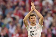 Bayern Munich's German forward #25 Thomas Mueller acknowledges the fans as he leaves the pitch during the German first division Bundesliga football match between Bayern Munich and Borussia Moenchengladbach in Munich on May 10, 2025. (Photo by Alexandra BEIER / AFP) / DFL REGULATIONS PROHIBIT ANY USE OF PHOTOGRAPHS AS IMAGE SEQUENCES AND/OR QUASI-VIDEO<!-- NICAID(16034572) -->