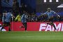 Uruguay's defender Ronald Araujo (R) celebrates after scoring during the 2026 FIFA World Cup South American qualification football match between Argentina and Uruguay at La Bombonera stadium in Buenos Aires on November 16, 2023. (Photo by Luis ROBAYO / AFP)Editoria: SPOLocal: Buenos AiresIndexador: LUIS ROBAYOSecao: soccerFonte: AFPFotógrafo: STF<!-- NICAID(15600153) -->