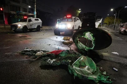 A burned garbage disposal on the street is seen after a group of Colo-Colo's fans tried to force their way into the stadium during the Copa Libertadores group stage football match between Chile's Colo Colo and Brazil's Fortaleza at the Monumental David Arellano stadium in Santiago, on April 10, 2025. Two people were killed Thursday in a stampede as a group of fans tried to force their way into Colo Colo's Monumental stadium in Santiago to watch the match against Brazil's Fortaleza for the Copa Libertadores 2025, authorities said. (Photo by Javier TORRES / AFP)<!-- NICAID(16014890) -->