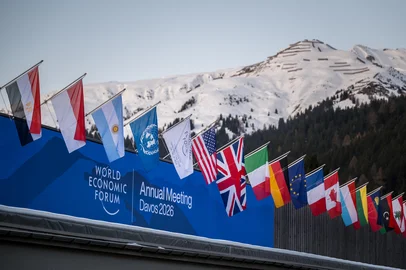 EDITORS NOTE: Graphic content / A sign of the World Economic Forum (WEF) is seen on the top of the Congress Centre that hosts the WEF annual meeting in the Alpine resort of Davos on its opening day in Davos on January 19, 2026. The World Economic Forum takes place in Davos from January 19 to January 23, 2026. (Photo by Fabrice COFFRINI / AFP)<!-- NICAID(16206753) -->