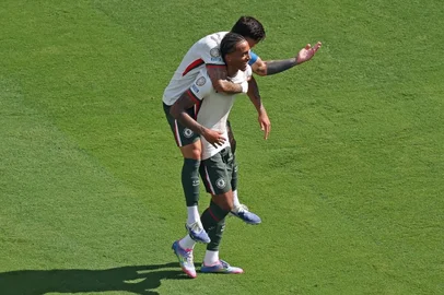 Chelsea's Brazilian forward #20 Joao Pedro celebrates with his teammate Chelsea's Argentinian midfielder #08 Enzo Fernandez after scoring his team's second goal during the FIFA Club World Cup 2025 semifinal football match between Brazil's Fluminense and England's Chelsea at the MetLife stadium in East Rutherford, New Jersey on July 8, 2025. (Photo by CHARLY TRIBALLEAU / AFP)<!-- NICAID(16076023) -->