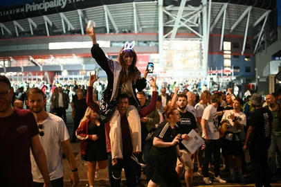 Fans of British rock band Oasis react outside the Principality Stadium in Cardiff on July 4, 2025, after attending the opening concert of their highly anticipated reunion tour nearly 16 years after last performing together. Two consecutive nights of concerts at the Principality Stadium in the Welsh capital mark the start of a 41-date run of gigs spanning the world. (Photo by Oli SCARFF / AFP)<!-- NICAID(16073998) -->