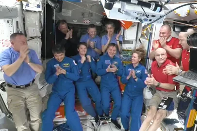This screengrab made from a NASA livestream shows the SpaceX Dragon Crew-10 members (C, in dark blue) NASA astronauts Anne McClain and Nichole Ayers, JAXA (Japan Aerospace Exploration Agency) astronaut Takuya Onishi, and Roscosmos cosmonaut Kirill Peskov, clapping after entering the International Space Station flanked by NASA astronauts Butch Wilmore, Suni Williams, Nick Hague and Don Pettit and Russian cosmonauts Aleksandr Gorbunov, Alexey Ochinin and Ivan Vagner, on March 16, 2025. The SpaceX Dragon Spacecraft carrying the four Crew-10 members docked to the International Space Station on March 16 at 12:04 a.m. EDT. Their arrival at the  the ISS will enable the long-overdue departure from the ISS of NASA duo Butch Wilmore and Suni Williams. The two former US Navy pilots have been stuck aboard the orbital lab since June after the Boeing Starliner spacecraft they were testing on its maiden crewed voyage suffered propulsion issues and was deemed unfit to fly them back to Earth. (Photo by NASA / AFP) / RESTRICTED TO EDITORIAL USE - MANDATORY CREDIT "AFP PHOTO / NASA " - NO MARKETING NO ADVERTISING CAMPAIGNS - DISTRIBUTED AS A SERVICE TO CLIENTS<!-- NICAID(15997091) -->