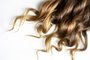 long brown curly hair on white isolated backgroundpiece of brown curly shiny hair on white isolated backgroundFonte: 294181967<!-- NICAID(14395020) -->