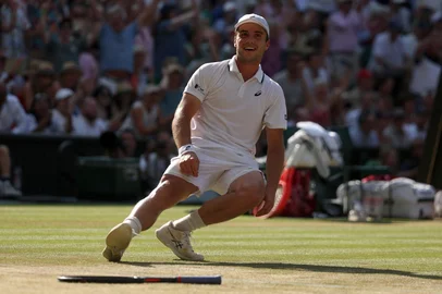 Britain's Arthur Fery celebrates winning against Italy's Flavio Cobolli during their men's singles quarter-final tennis match on the tenth day of the 2026 Wimbledon Championships at The All England Lawn Tennis and Croquet Club in Wimbledon, southwest London, on July 8, 2026. (Photo by Adrian Dennis / AFP) / RESTRICTED TO EDITORIAL USE<!-- NICAID(16324244) -->