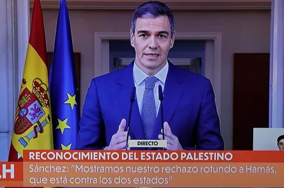 A picture of a TV screen taken on May 28, 2024 shows Spain's Prime Minister Pedro Sanchez delivering a speech over the recognition of Palestinian statehood by Spain, at La Moncloa Palace in Madrid. Recognising Palestinian statehood is 'essential for reaching peace' said Spain's Prime Minister Pedro Sanchez on May 28, 2024. Spain, Ireland and Norway will formally recognise a Palestinian state Tuesday in a decision slammed by Israel as a "reward" for Hamas more than seven months into the devastating Gaza war. (Photo by Thomas COEX / AFP)<!-- NICAID(15774869) -->