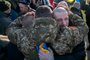 This handout photograph taken and released on January 31, 2024 by the Ukrainian Presidential Press Service, shows Ukrainian former prisoners of war reacting following a prisoner exchange, amid Russia's military invasion on Ukraine. Russia and Ukraine exchanged hundreds of prisoners of war on January 31, just a week after Moscow said Kyiv had shot down a plane carrying dozens of captured Ukrainian soldiers. Russia's defence ministry said 195 of its soldiers were freed, while Ukrainian President Volodymyr Zelensky said 207 people -- both soldiers and prisoners -- had returned to Ukraine. (Photo by Handout / UKRAINIAN PRESIDENTIAL PRESS SERVICE / AFP) / - NO Editorial use - NO Marketing campaign / -----EDITORS NOTE --- RESTRICTED TO EDITORIAL USE - MANDATORY CREDIT "AFP PHOTO / HANDOUT /  Ukrainian Presidential Press Service " - NO MARKETING - NO ADVERTISING CAMPAIGNS - DISTRIBUTED AS A SERVICE TO CLIENTS / <!-- NICAID(15666590) -->