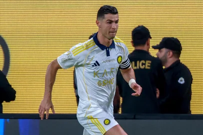 Nassr's Portuguese forward #7 Cristiano Ronaldo runs with the ball during the Saudi Pro League football match between Al-Nassr and Al-Khaleej at Al-Awwal Park in Riyadh on May 21, 2025. (Photo by Fayez NURELDINE / AFP)<!-- NICAID(16046295) -->