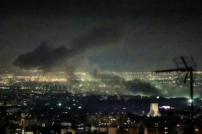 Smoke plumes billow from the site of airstrikes near Azadi Tower in western Tehran on March 10, 2026. The United States and Israel launched strikes against Iran on February 28, sparking swift retaliation by the Islamic republic which responded with missile attacks across the region. The war has dragged in global powers, upended the world's energy and transport sectors, and brought chaos to even usually peaceful areas of the volatile region. (Photo by ATTA KENARE / AFP) / ATTENTION EDITORS: AFP COVERS THE WAR IN THE MIDDLE EAST THROUGH ITS EXTENSIVE REGIONAL NETWORK, INCLUDING BUREAUS IN TEHRAN, JERUSALEM AND SEVERAL NEIGHBORING COUNTRIES.SINCE THE START OF THE CONFLICT, JOURNALISTS HAVE BEEN WORKING UNDER INCREASINGLY RESTRICTIVE CONDITIONS. AUTHORITIES IN SEVERAL COUNTRIES HAVE LIMITED REPORTERS MOVEMENTS, PHOTO AND LIVE VIDEO COVERAGE FROM SENSITIVE LOCATIONS. SOME GOVERNMENTS AND ARMED GROUPS HAVE BANNED IMAGES OF MISSILE OR DRONE STRIKES AND OTHER SECURITY-RELATED SITES. / <!-- NICAID(16242200) -->