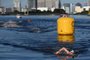 Germany's Florian Wellbrock competes to win and take gold in the men's 10km marathon swimming event during the Tokyo 2020 Olympic Games at the Odaiba Marine Park in Tokyo on August 5, 2021. (Photo by Oli SCARFF / AFP)<!-- NICAID(14854384) -->