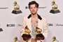 LOS ANGELES, CALIFORNIA - FEBRUARY 05: Harry Styles poses with the Best Pop Vocal Album Award for Harrys House and Album of the Year Award for Harrys House in the press room during the 65th GRAMMY Awards at Crypto.com Arena on February 05, 2023 in Los Angeles, California.   Alberto E. Rodriguez/Getty Images for The Recording Academy/AFP (Photo by Alberto E. Rodriguez / GETTY IMAGES NORTH AMERICA / Getty Images via AFP)<!-- NICAID(15341002) -->