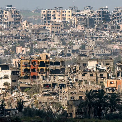 This picture taken from Israel's southern border with the Gaza Strip on March 19, 2024 shows a view of destroyed buildings in the Palestinian territory following bombardments amid the ongoing conflict between Israel and the militant group Hamas. (Photo by JACK GUEZ / AFP)<!-- NICAID(15710519) -->