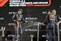 Red Bull's Dutch driver Max Verstappen (L), Red Bull's Mexican driver Sergio Perez (2nd-R) and Red Bull's Trackside Infrastructure Group Leader Olaf Janssen celebrate on the podium after the Abu Dhabi Formula One Grand Prix at the Yas Marina Circuit in the Emirati city of Abu Dhabi on November 20, 2022. (Photo by Karim Sahib / AFP)Editoria: SPOLocal: Abu DhabiIndexador: KARIM SAHIBSecao: motor racingFonte: AFPFotógrafo: STF<!-- NICAID(15270770) -->