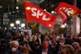 Supporters wave flags at the Social Democrats (SPD) headquarters after the exit polls were broadcast on television in Berlin on September 26, 2021 after the German general elections. (Photo by Odd ANDERSEN / AFP)<!-- NICAID(14899469) -->