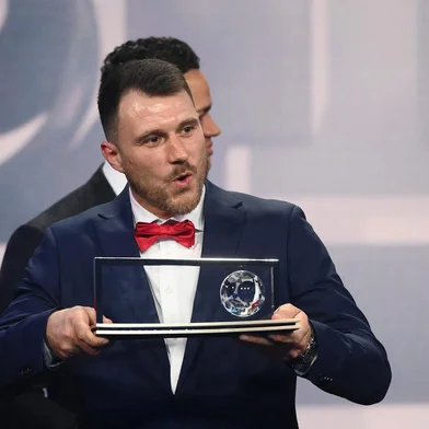 Warta Poznan's Polish player Marcin Oleksy delivers a speech after receiving the FIFA Puskas Award for best goal during the Best FIFA Football Awards 2022 ceremony in Paris on February 27, 2023. (Photo by FRANCK FIFE / AFP)<!-- NICAID(15361335) -->