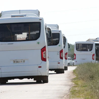 Buses drive on the road during the evacuation in the small town of Oktyabr'skoye near Simferopol, on July 22, 2023. A Ukrainian drone attack on Crimea Saturday blew up an ammunition depot, sparking evacuations on the Moscow-annexed peninsula and halting rail traffic, just five days after drones damaged Russia's symbolic bridge across the Kerch Strait. (Photo by STRINGER / AFP)<!-- NICAID(15489933) -->