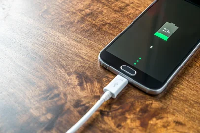 Close up view of smartphone charging battery<!-- NICAID(16035484) -->