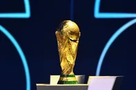 The FIFA World Cup Trophy is displayed on a podium during the draw for the 2026 FIFA Football World Cup taking place in the US, Canada and Mexico, at the Kennedy Center, in Washington, DC, on December 5, 2025. (Photo by Mandel NGAN / POOL / AFP)<!-- NICAID(16181289) -->