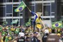 Supporters of Brazilian former President Jair Bolsonaro invade Planalto Presidential Palace in Brasilia on January 8, 2023. - Hundreds of supporters of Brazil's far-right ex-president Jair Bolsonaro broke through police barricades and stormed into Congress, the presidential palace and the Supreme Court Sunday, in a dramatic protest against President Luiz Inacio Lula da Silva's inauguration last week. (Photo by Sergio Lima / AFP)Editoria: WARLocal: BrasíliaIndexador: SERGIO LIMASecao: demonstrationFonte: AFPFotógrafo: STR<!-- NICAID(15315538) -->