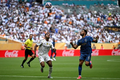 Real Madrid's Brazilian forward #11 Rodrygo and Al Hilal's Brazilian defender #06 Renan Lodi fight for the ball during the FIFA Club World Cup 2025 Group H football match between Spain's Real Madrid and Saudi's Al-Hilal at the Hard Rock stadium in Miami on June 18, 2025. (Photo by PATRICIA DE MELO MOREIRA / AFP)<!-- NICAID(16062972) -->