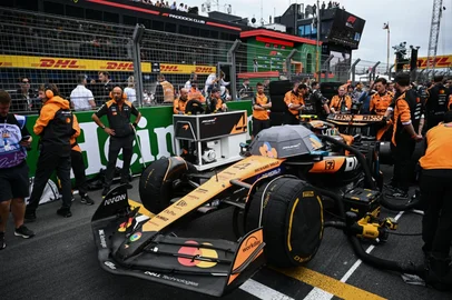 McLaren's team stand next to McLaren's British driver Lando Norris car on the grid ahead of the Formula One Dutch Grand Prix at The Circuit Zandvoort, western Netherlands, on August 31, 2025. (Photo by NICOLAS TUCAT / AFP)<!-- NICAID(16113721) -->