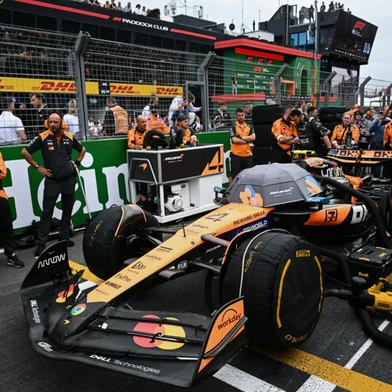 McLaren's team stand next to McLaren's British driver Lando Norris car on the grid ahead of the Formula One Dutch Grand Prix at The Circuit Zandvoort, western Netherlands, on August 31, 2025. (Photo by NICOLAS TUCAT / AFP)<!-- NICAID(16113721) -->
