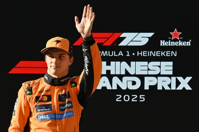 McLaren's Australian driver Oscar Piastri celebrates after taking pole position during the qualifying session of the Formula One Chinese Grand Prix at the Shanghai International Circuit in Shanghai on March 22, 2025. (Photo by Jade Gao / AFP)<!-- NICAID(16001273) -->