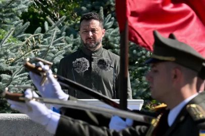 UkrainE'S President Volodymyr Zelensky stands in front of the Ukrainian guard of honor parade as he attends a ceremony marking the National Flag Day of Ukraine in Kyiv on August 23, 2026, amid Russian invasion of Ukraine. Zelensky said in remarks made public on August 23, 2026 that it would be too dangerous for Ukraine to hold an election while it fights Russia's invasion, after a call by his former defence minister to organise a vote. (Photo by Sergei SUPINSKY / AFP)<!-- NICAID(16351195) -->