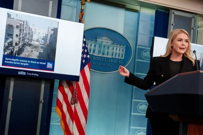 WASHINGTON, DC - FEBRUARY 5: A FOX News image depicting Gaza with words "Apocalyptic scenes in Gaza as Israel bombs terror targets" is displayed behind White House Press Secretary Karoline Leavitt as she speaks during a news conference in the Brady Press Briefing Room at the White House on February 5, 2025 in Washington, DC. Leavitt discussed the president's views on Gaza, the Panama Canal, and a "No Men In Women's Sports" executive order the president is set to sign later today, and other topics.   Andrew Harnik/Getty Images/AFP (Photo by Andrew Harnik / GETTY IMAGES NORTH AMERICA / Getty Images via AFP)<!-- NICAID(15969792) -->