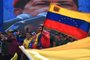 Venezuela's President Nicolas Maduro (C-R) waves a national flag next to First Lady Cilia Flores (C-L) during a rally to commemorate 20 years of the anti-imperialist declaration of the late former President Hugo Chavez in Caracas on February 29, 2024. (Photo by Federico PARRA / AFP)<!-- NICAID(15697988) -->